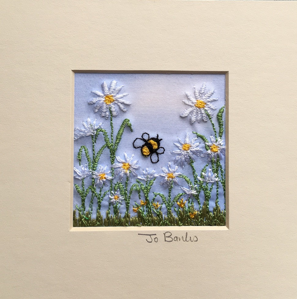 Daisies with bee