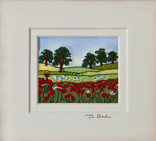 Poppy landscape with sheep